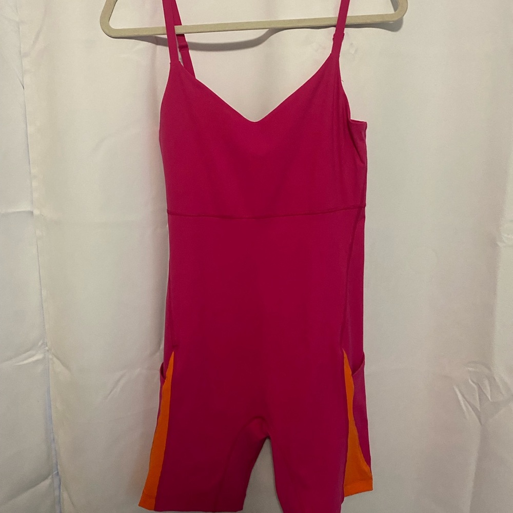 Outdoor Voices Unitard Hot Pink and Orange with two side pockets.